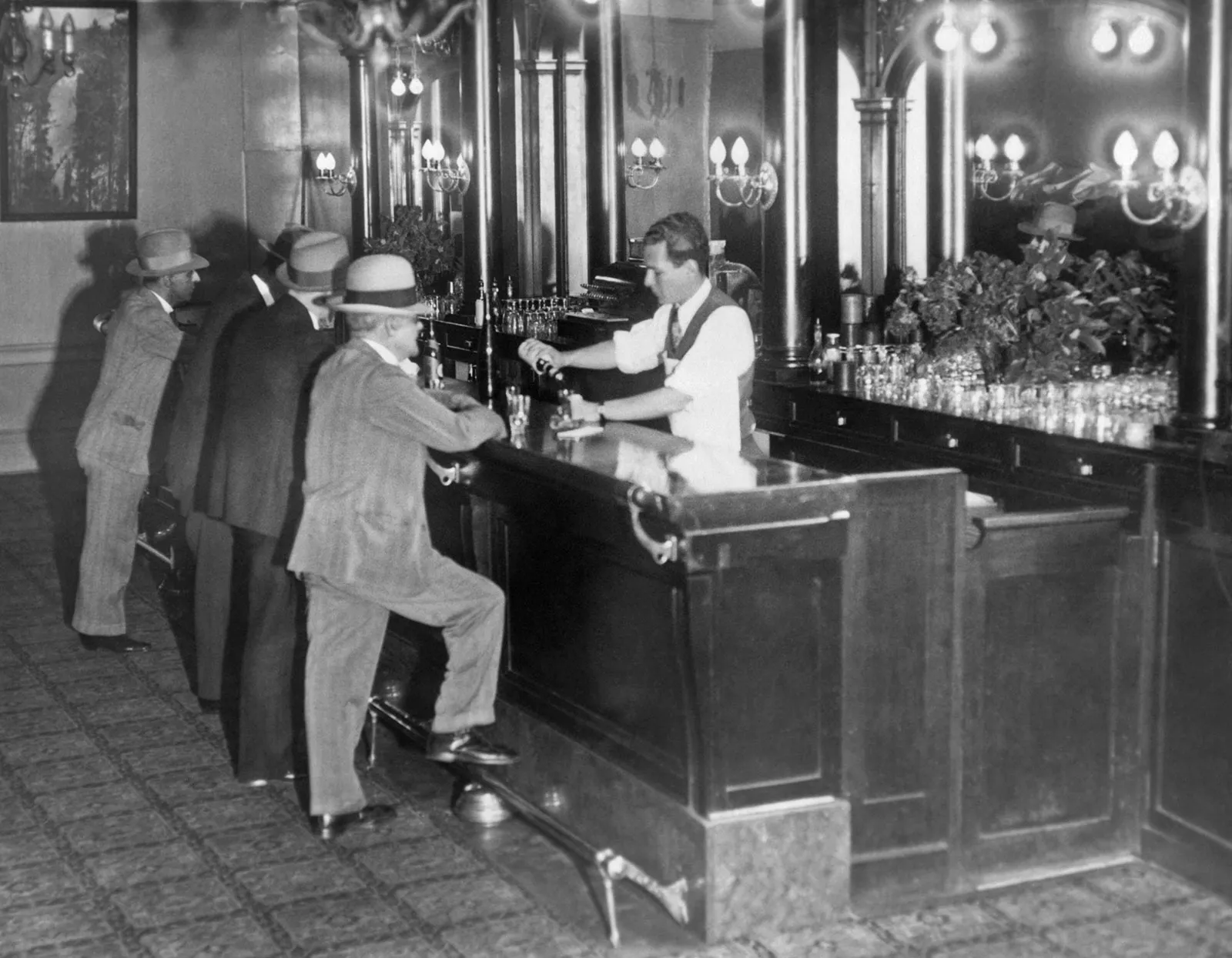 Bartender serving drinks at a hidden bar